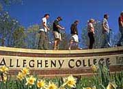 Students walking along the Allegheny College sign